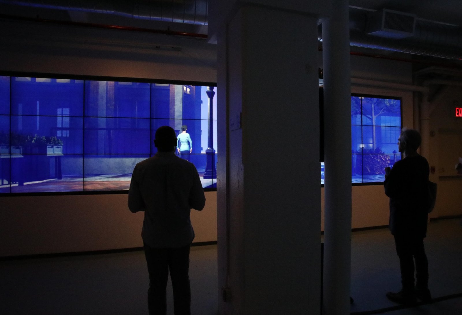 Expanded Cinema Vol.3: a viewer silhouetted against the blue screens