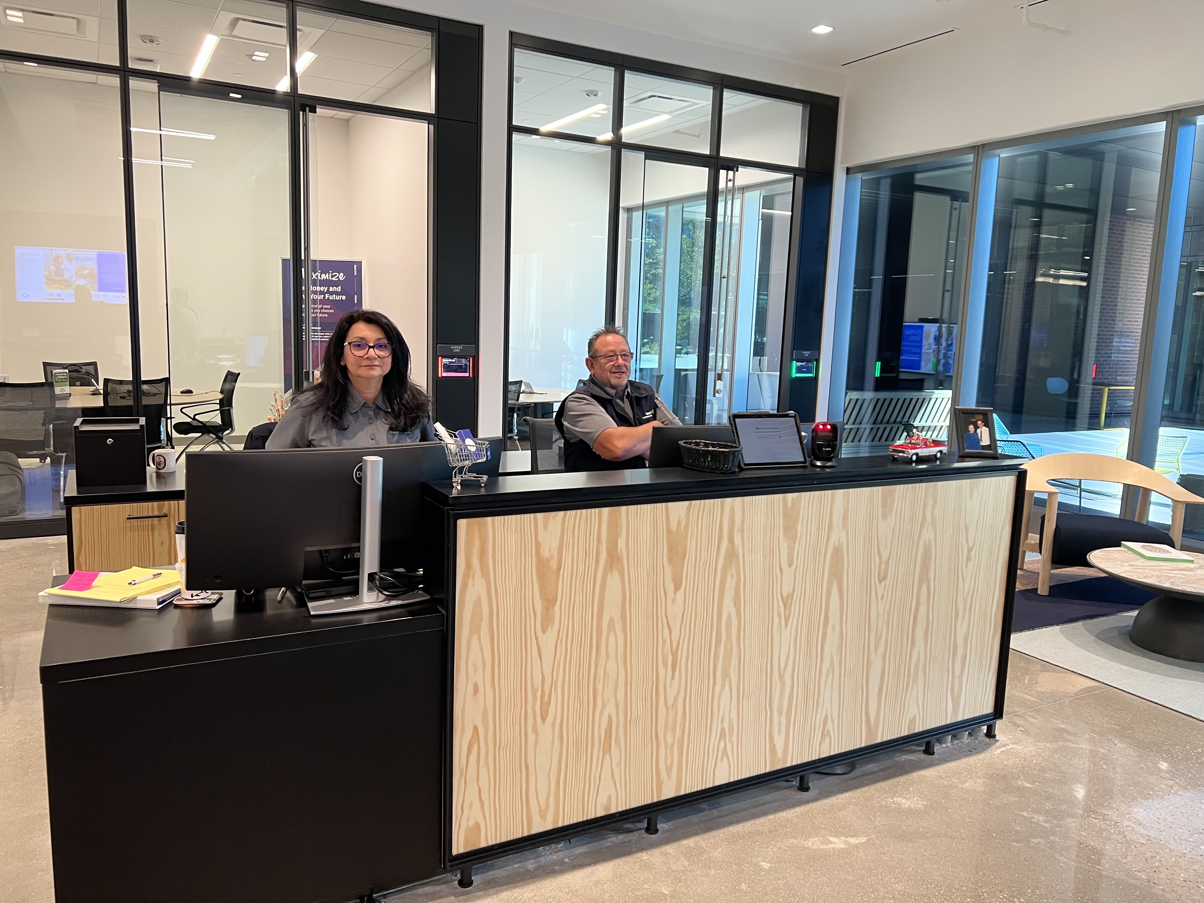 Front desk associate at a Walmart campus using the Visit Admin Portal